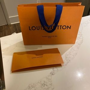 Louis Vuitton shopping bag and receipt holder